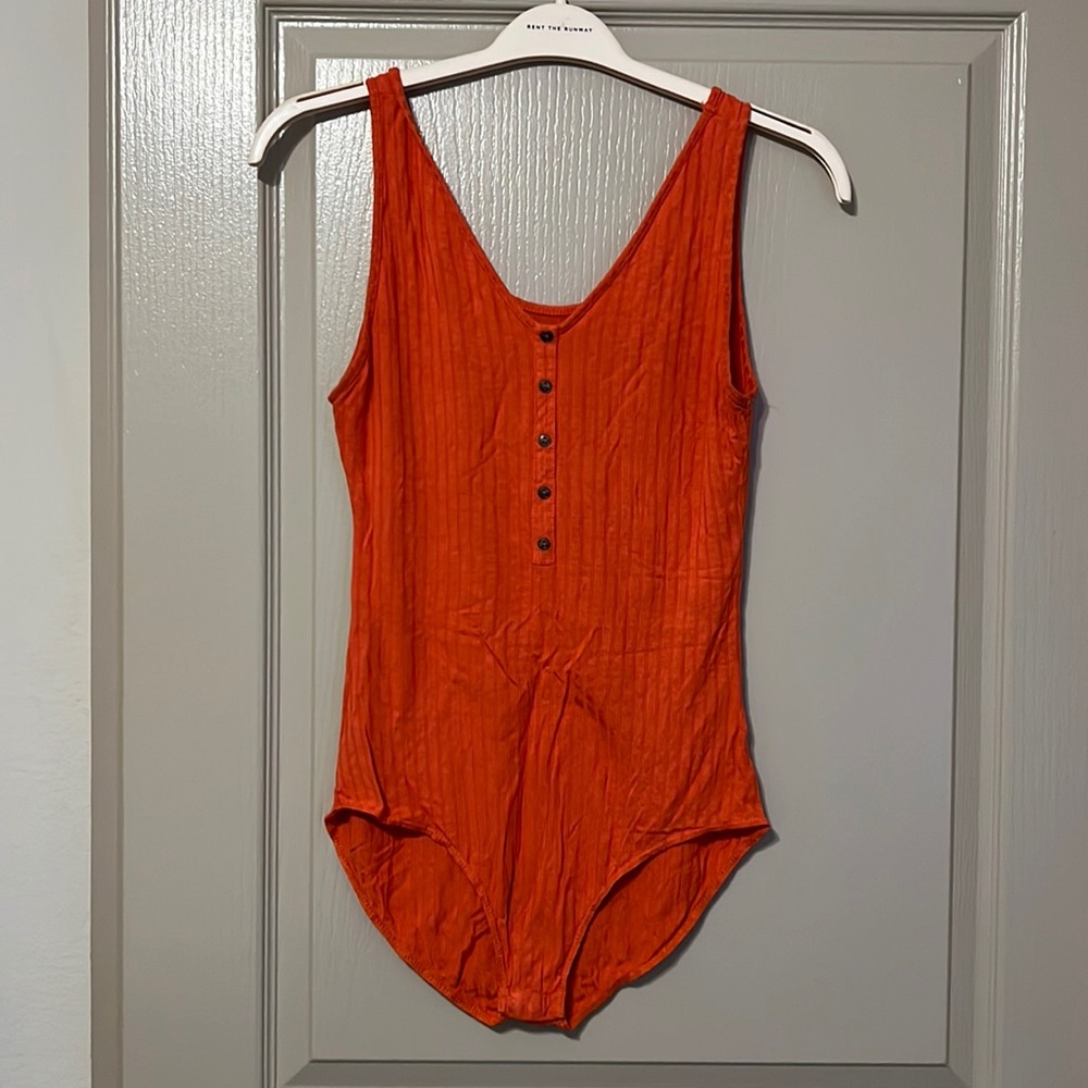 Women’s orange bodysuit